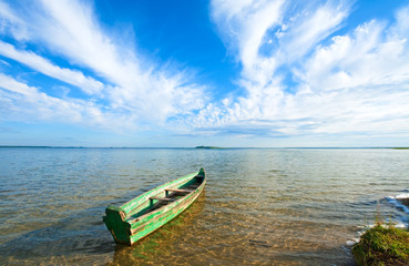  boat on summer lake bank