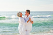 © WavebreakMediaMicro - Retired couple dancing on the beach