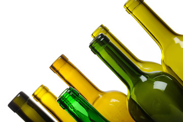 Many empty green wine bottles isolated on white background