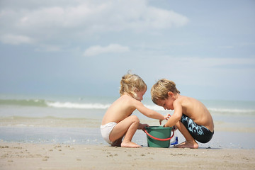 two children playing on beach