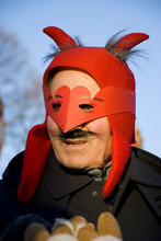 Man With Red Mardi Gras Mask