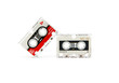 © evgenyi - two audio cassettes on a white background.
