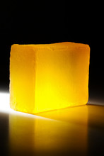 Yellow Handmade Soap In Darkness. Backlit