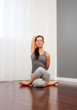 © ArtFamily - woman doing yoga exercise on floor