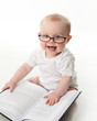 © blessings - Baby reading with glasses