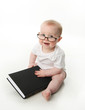 © blessings - Baby reading wearing glasses