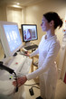 Radiology technician performing mammography scan