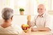 © nyul - Portrait of senior man at breakfast