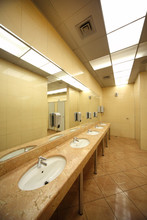 Sinks And Mirrors In Public Restrooms, Yellow Tiles On Floor