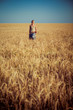 © Nastya Tepikina - Image of young woman on wheat field