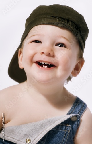 Fotografie, Obraz Head And Shoulders Portrait Of A Boy Laughing