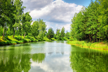 Wall Mural - Summer landscape with river and blue sky