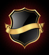 Black shield with a golden frame and a ribbon for your message
