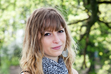 young girl smiling in a park