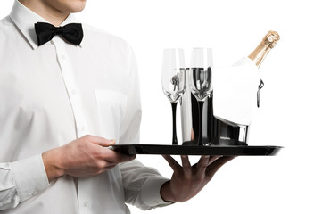 Wall Mural - Waiter hands champagne in bucket and stemware on tray