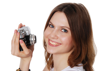 Pretty woman taking photo with vintage camera