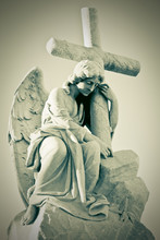 Grunge Image Of A Sad Angel Holding A Cross In Greenish Shades