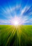 Fototapeta Lawenda - Abstract motion blurred meadow and sky with sun