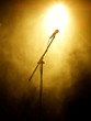 Microphone on stage with stage-lights in the background