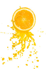 Wall Mural - orange juice splashing from cut orange, isolated