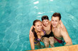 © pressmaster - Family in pool