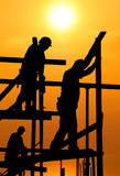 Fototapeta Krajobraz - Construction workers under a hot blazing sun