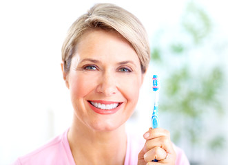 Poster - Woman with a  toothbrush