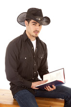 Cowboy With Book Looking