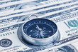 © natavin - Macro shot of compass with 100 dollar bill Ben Franklin