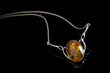 amber pendant on silver necklace