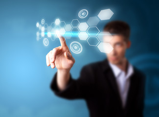 Poster - A businessman working on modern technology