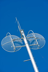 Communications Tower with twin wire sattelite dishes