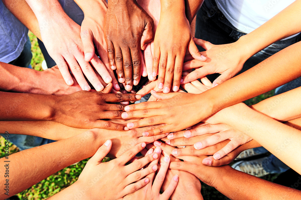 many hands together: group of people joining hands - obrazy, fototapety, plakaty 