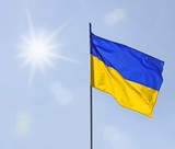 Fototapeta  - A sun above the flag of Ukraine