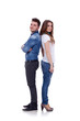© Viorel Sima - smiling young couple standing back to back