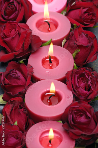 Fototapeta na wymiar Row of red candlelight with rose in line