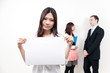 © taka - asian woman holding a blank whiteboard