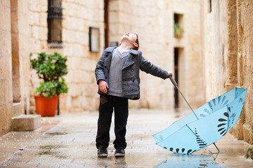 Cute boy on rainy day