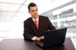© cristovao31 - young business man working with is laptop at the office