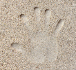 hand print in sand