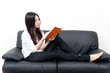 © taka - beautiful asian woman relaxing on the couch