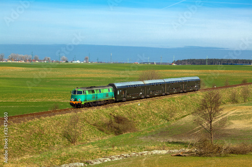 Nowoczesny obraz na płótnie Passenger train passing through countryside