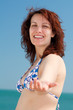 © Mr Korn Flakes - Woman Lending a Hand on a Beach