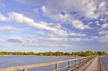 wooden bridge on lake perspective