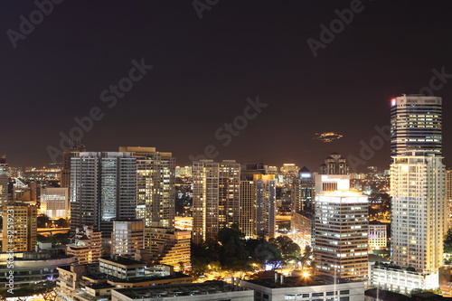 Fotoboard na płycie Oświetlone wieżowce w centrum Kuala Lumpur w nocy