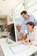 © goodluz - Group of senior people in business training