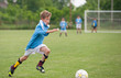 © Dusan Kostic - Little Boy playing soccer