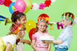 © 2xSamara.com - Preschool boy offering birthday cake to his guests