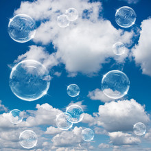 Soap Bubbles On Cloudy Sky Background