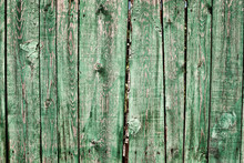 Grungy Green Wooden Picket Fence With Peeling Paint